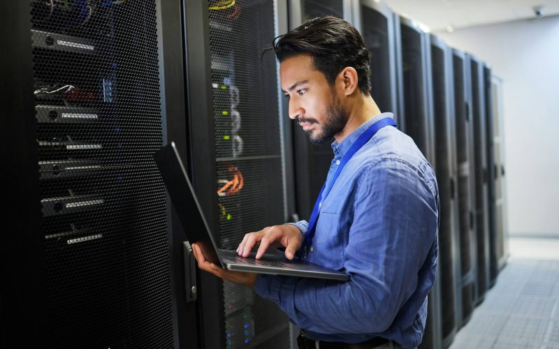 programming-data-center-and-a-man-with-a-laptop-for-maintenance-cyber-security-and-internet-check.jpg programming-data-center-and-a-man-with-a-laptop-for-maintenance-cyber-security-and-internet-check.jpg